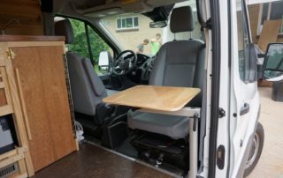 slide out table custom camper van conversion in golden, colorado