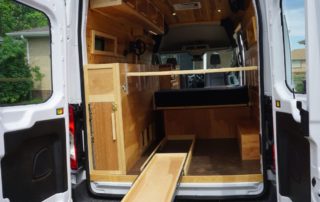 slide out shelf on custom camper van conversion in golden, colorado