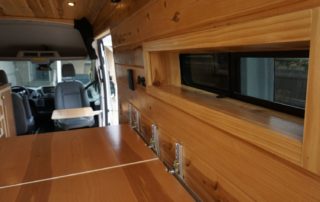 custom window on ford transit 350 custom camper van conversion in golden, colorado