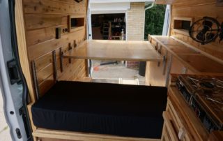 cutting board and view of custom camper van conversion in golden, colorado