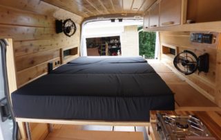 bed in ford transit 350 custom camper van conversion in golden, colorado